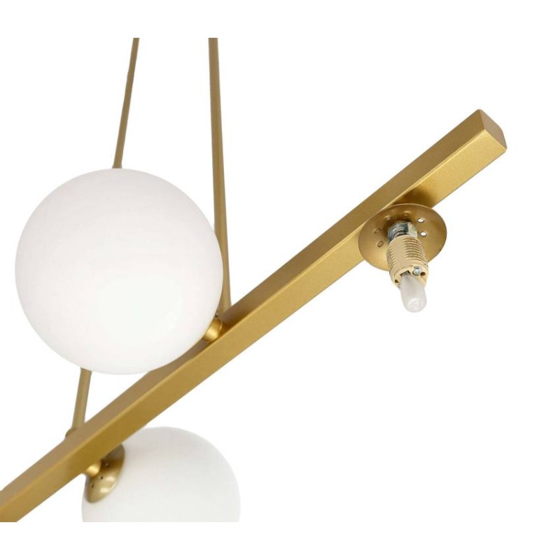 złota lampa wisząca z kulami