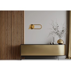 Kinkiet naścienny złoty owal MONET klosz akrylowy 13W LED do sypialni zamontowany na ścianie nad meblem