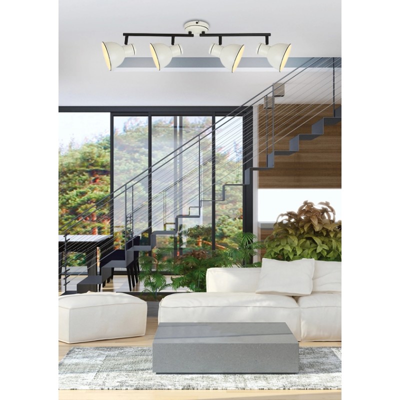 Lampa sufitowa biało czarna zumba zamontowana na suficie nad sofą w salonie na tle schodów.